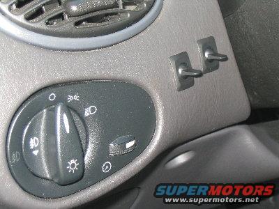 fog-switches.jpg The switches i installed for the fog lights.  Left one turns on the halos, right one turns on the fogs (they're also wired into the factory switch so i can still turn them on with that).