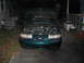 1993 Ford Taurus - Green 1993 Ford Taurus SHO with hood open, revealing the engine bay.