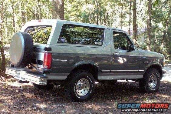 Two-tone gray 1996 Ford Bronco with a rear-mounted spare tire