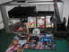 1994 Ford Probe - A collection of PlayStation 2 games and accessories is displayed on a carpeted floor in front of a media stand.