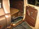 1978 Ford F-250 - Interior view of a 1978 Ford F-250, highlighting the door panel, seat, and significant rust on the rocker panel.