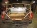 1978 Ford F-250 - Rear view of a 1978 Ford F-250 pickup truck, showing the bed with a toolbox and pallet.