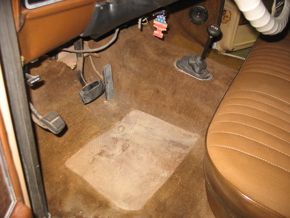 1978 Ford F-250 interior showing floor pedals, floor mat, and bench seat