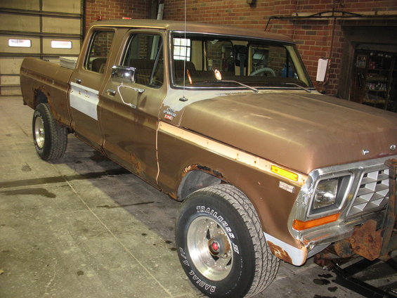 Brown 1978 Ford F-250 pickup truck with rust damage, seen from a 3/4 front angle