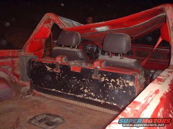 From behind.  (Most of the damage to the roof was from when it was winched putting the rubber back down.