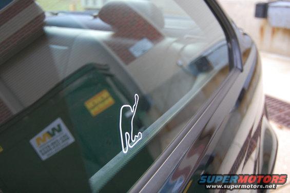 Car interior with race track sticker on window