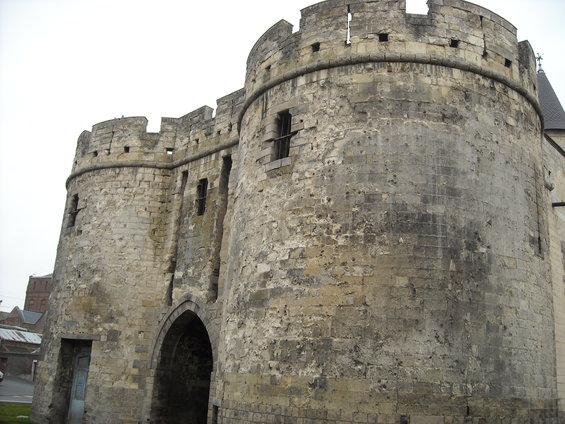 stone castle gate with arched entrance and crenellated top