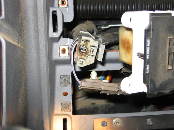 Close-up of vehicle interior wiring harness with burnt connector