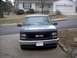 1995 GMC Sierra 1500 - A 1995 GMC Sierra 1500 is parked in front of a house.
