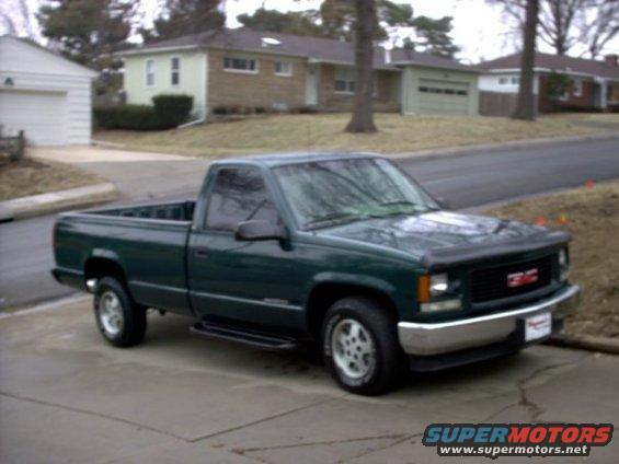 Green 1995 GMC Sierra 1500 pickup truck, 3/4 front view
