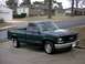 1995 GMC Sierra 1500 - This 1995 GMC Sierra 1500 pickup truck is shown in a 3/4 front view, parked in a driveway.
