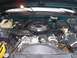 1995 GMC Sierra 1500 - The engine bay of a vehicle, showing various components like the air intake and brake system.