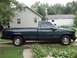 1995 GMC Sierra 1500 - Side profile of a 1995 GMC Sierra 1500 pickup truck with tinted windows.