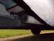 1995 GMC Sierra 1500 - Close-up view of an exhaust pipe extending from the underside of a vehicle.