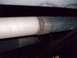 1995 GMC Sierra 1500 - A close-up view shows a weld on a vehicle's exhaust pipe, with a watermark at the bottom right.