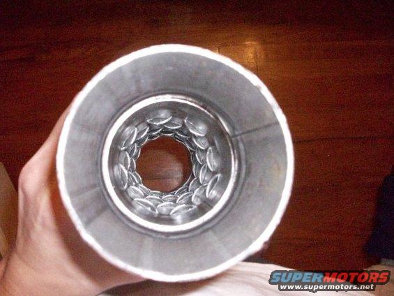 Exhaust tip with perforated baffle