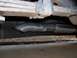 1995 GMC Sierra 1500 - Close-up view of a vehicle's aftermarket exhaust system, showing the muffler and tailpipe.