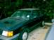 1989 Ford Escort - This 1989 Ford Escort coupe is seen parked in a lot with trees in the background.