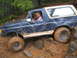 1989 Ford Bronco - This Ford Bronco is off-roading on a challenging rocky path.