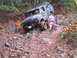 1989 Ford Bronco - This Ford Bronco is navigating a challenging rocky terrain.