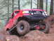 1989 Ford Bronco - Modified 1989 Ford Bronco tackling a challenging off-road trail.