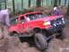 1989 Ford Bronco - This red SUV is equipped for off-road trails, a winch and modified suspension.