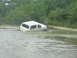 1989 Ford Bronco - This 1989 Ford Bronco appears to be stuck in a muddy, watery area, with its front end submerged.