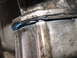 1989 Ford Bronco - Transmission gasket leak showing blue sealant squeezed out from the seal.