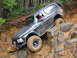 1979 Ford Bronco - This vehicle is navigating a challenging off-road course, demonstrating its capabilities on rough terrain.