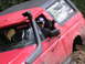1979 Ford Bronco - Driver holds a Monster Energy can while sitting in a red 1979 Ford Bronco equipped with a snorkel.