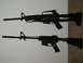 2001 Ford F-350 - Two black rifles are shown mounted on a wall, with a SuperMotors.net watermark at the bottom right.