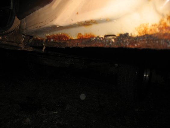 Passenger side rear door, inside bottom.