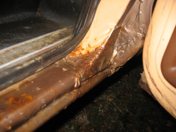 Back of center post, passenger side. Front side of rear door.