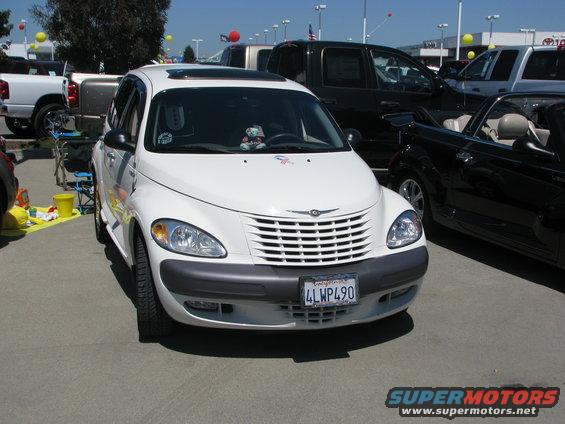 White Chrysler PT Cruiser with a sunroof and a California license plate