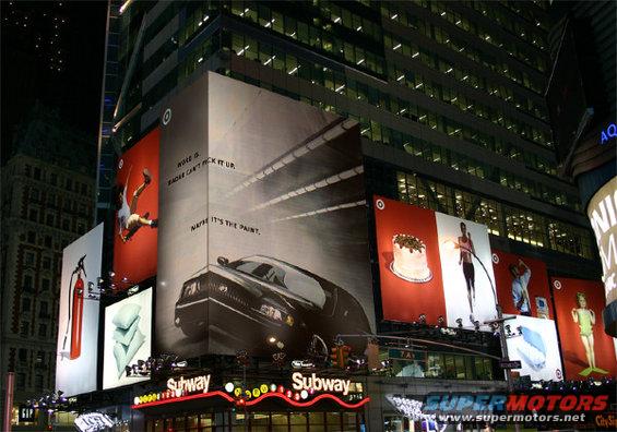 Times Square building at night with large advertisements for Target and Subway