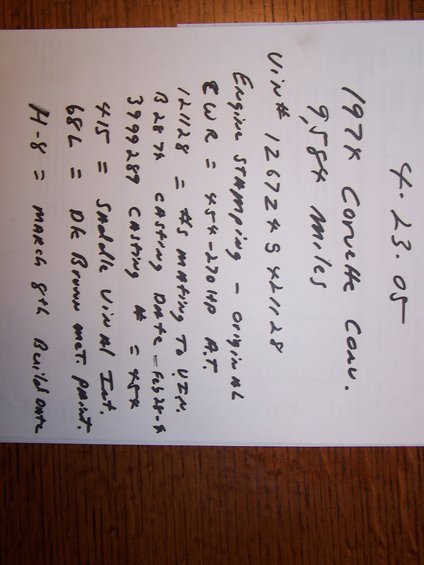 Handwritten document with vehicle information, including VIN and build date