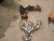 1990 Ford Probe - A comparison of a used exhaust manifold next to a newly chromed one.