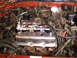1990 Ford Probe - Close-up view of an engine bay a chrome valve cover with "3.0 VE" visible.