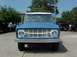 1966 Ford Bronco - This blue 1966 Ford Bronco is shown from the front, its distinctive grille and round headlights.