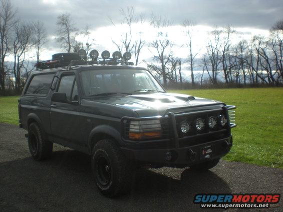 1993 Ford Bronco with roof rack, bull bar, and extra lights