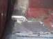 1988 Ford Bronco - Close-up of a metal floor pan being repaired with visible welding marks.