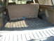1988 Ford Bronco - Interior view of the cargo area in a 1988 Ford Bronco, showing the folded rear seat.