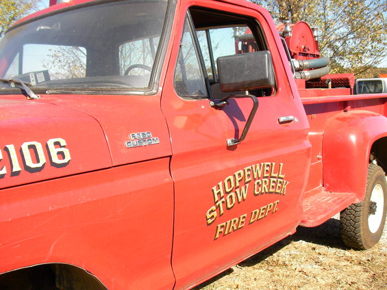 Red 1979 Ford F-350 fire truck with "HOPEWELL STOW CREEK FIRE DEPT" text on the door