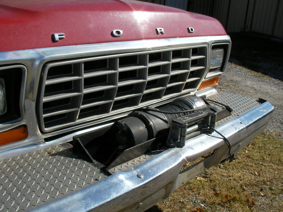Red 1979 Ford F-350 front view with winch