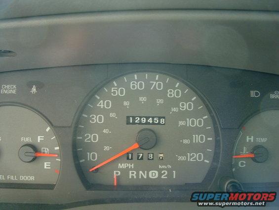 speedometer reads 17 mph, odometer shows 129458 miles, fuel gauge is on E