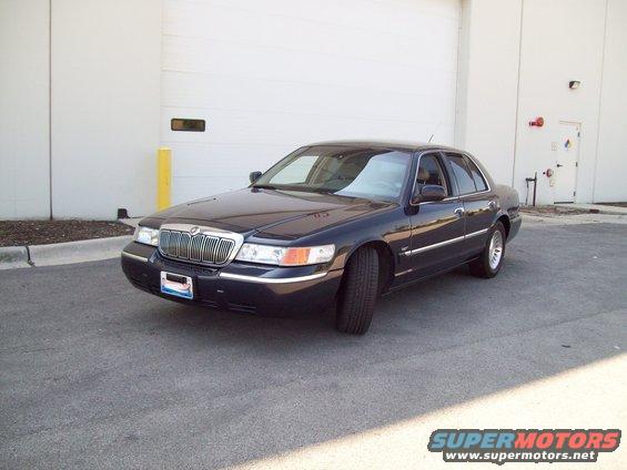 1999 Mercury Grand Marquis parked outside a building