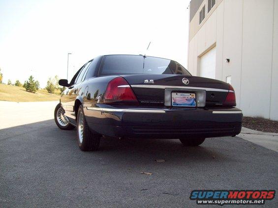 Dark blue Mercury Grand Marquis seen from rear, with chrome trim and Illinois license plate