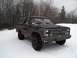 1988 Chevrolet Blazer - A black Chevrolet K5 Blazer sits in a snowy field with trees in the background.