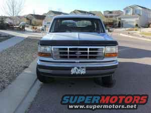 Silver Ford Bronco front view, grille shows horizontal bars and rectangular headlights