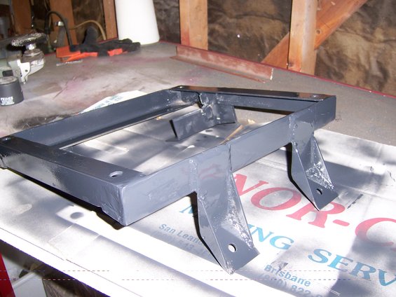 Gray painted seat bracket with mounting holes